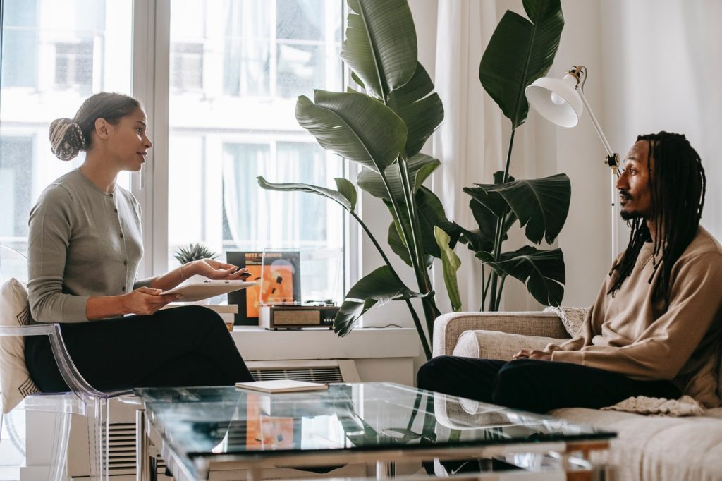 Counsellor talking with a client in a calm, bright room